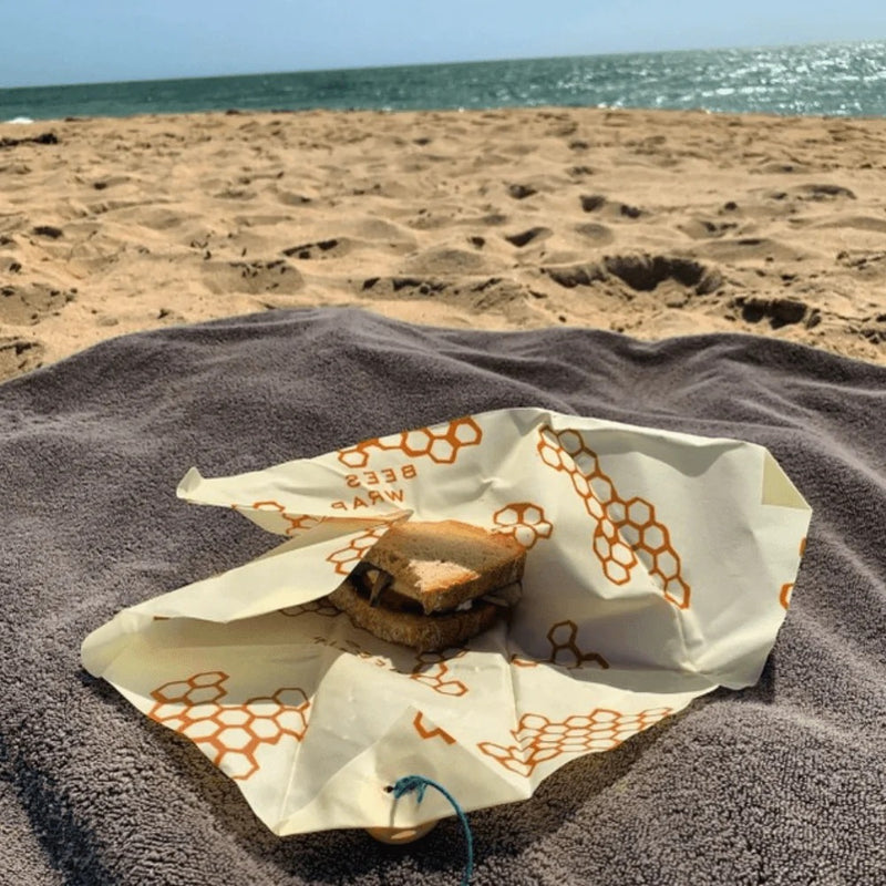 Sandwich setting on Bee's Wrap Sandwich Wrap at the beach