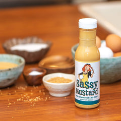 Sassy Mustard bottle on table with spices